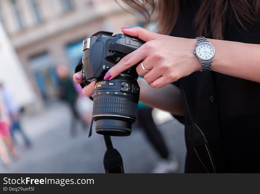 Woman Holding Black Dslr Camera