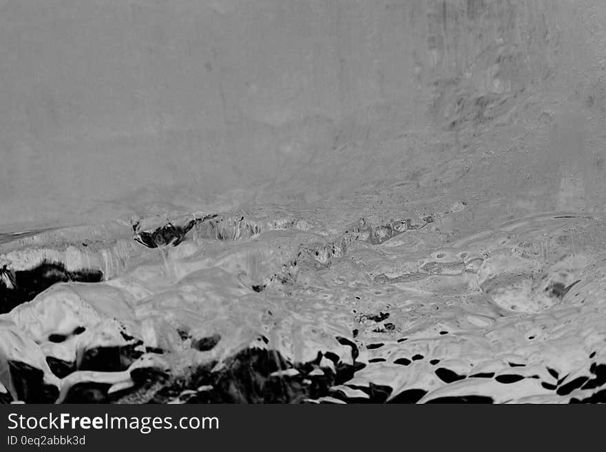 Melting snow on rocky landscape in black and white. Melting snow on rocky landscape in black and white.