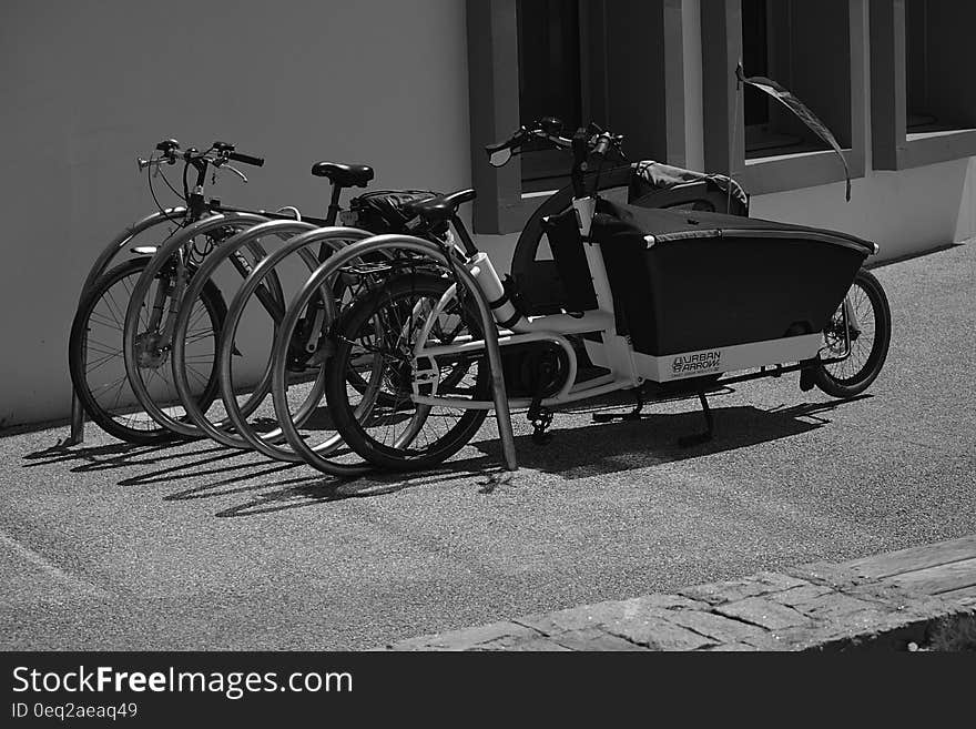 Greyscale Photo of Utility Bike during Daytime