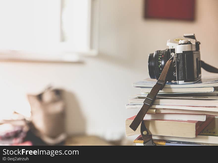 Black Bridge Camera on Top of Piled Books