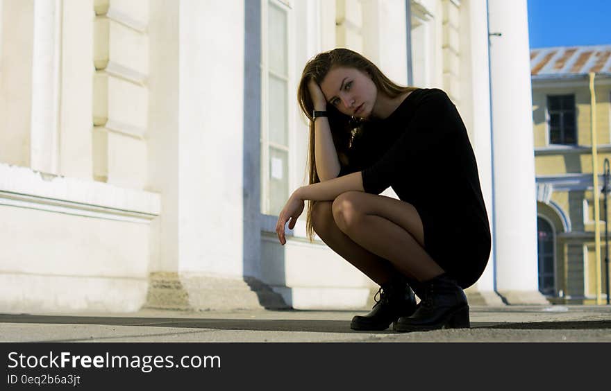 Woman in Black Bodycon Dress Taking a Pose