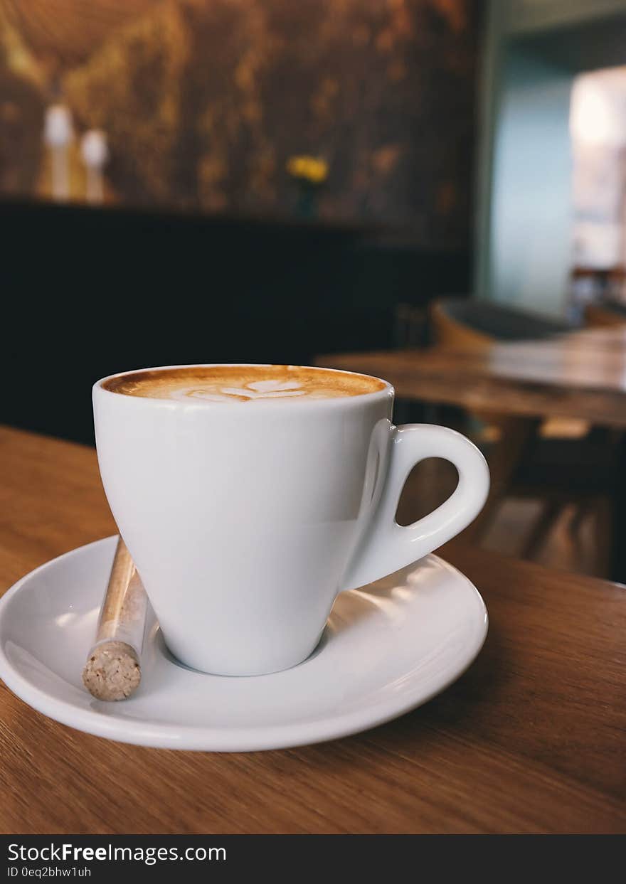 White Ceramic Cup on White Ceramic Saucer With White Espresso Coffe