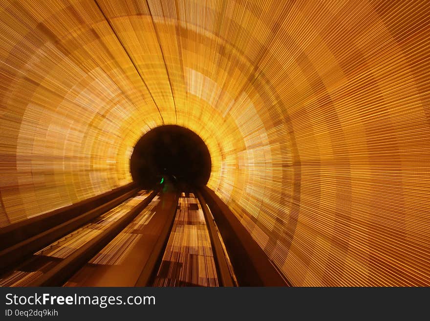 A long exposure of a brightly lit tunnel.