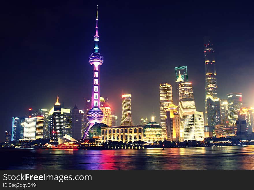 Shanghai city skyline at night on the Pudong, China.