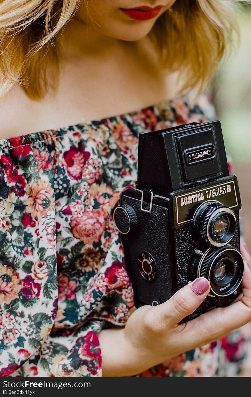 Woman Holding Black Nomo Vintage Camera