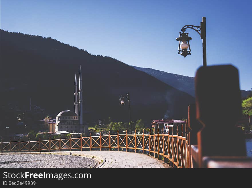 Black Steel Street Lamp Near Wooden Fence