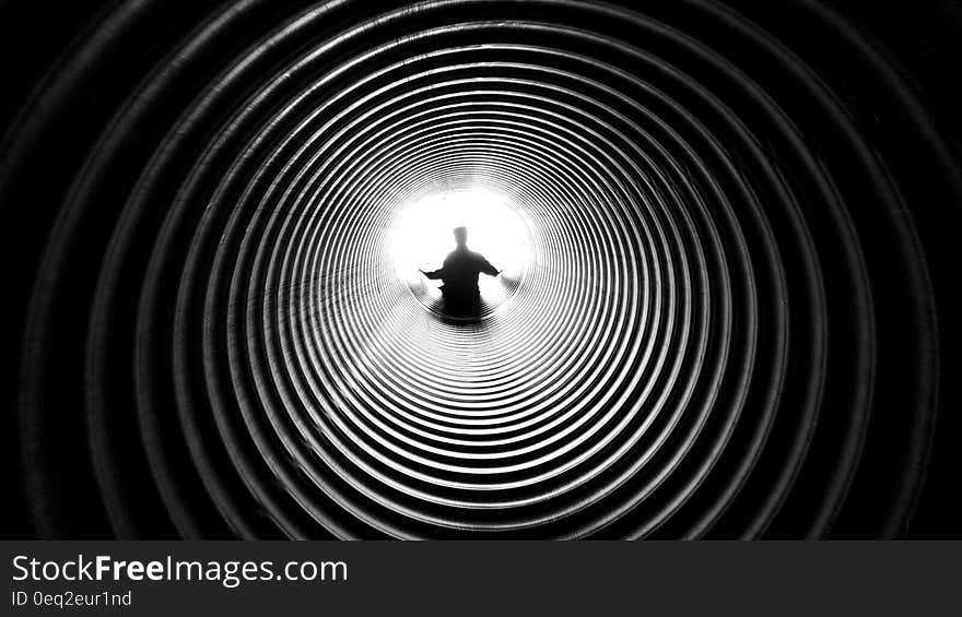 Grayscale Photography of Person at the End of Tunnel