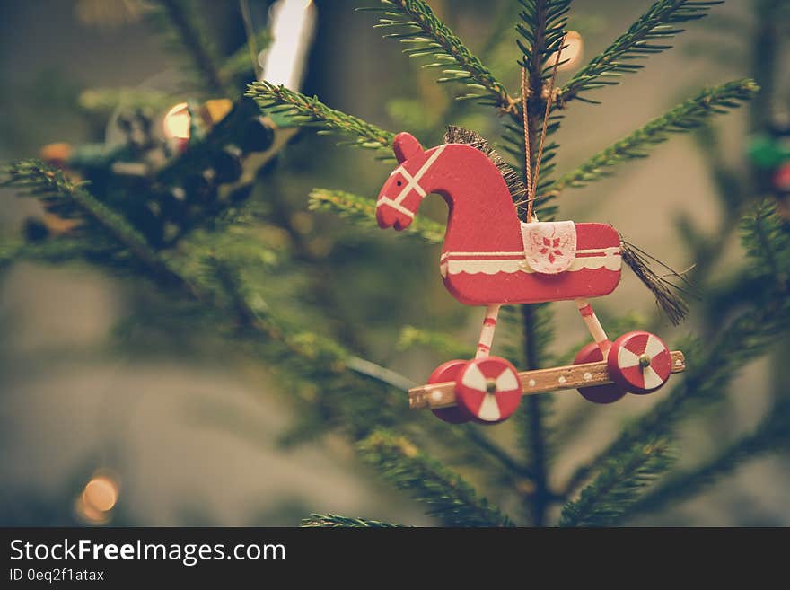 Brown and Red Horse Decor Hanged on Christmas Tree