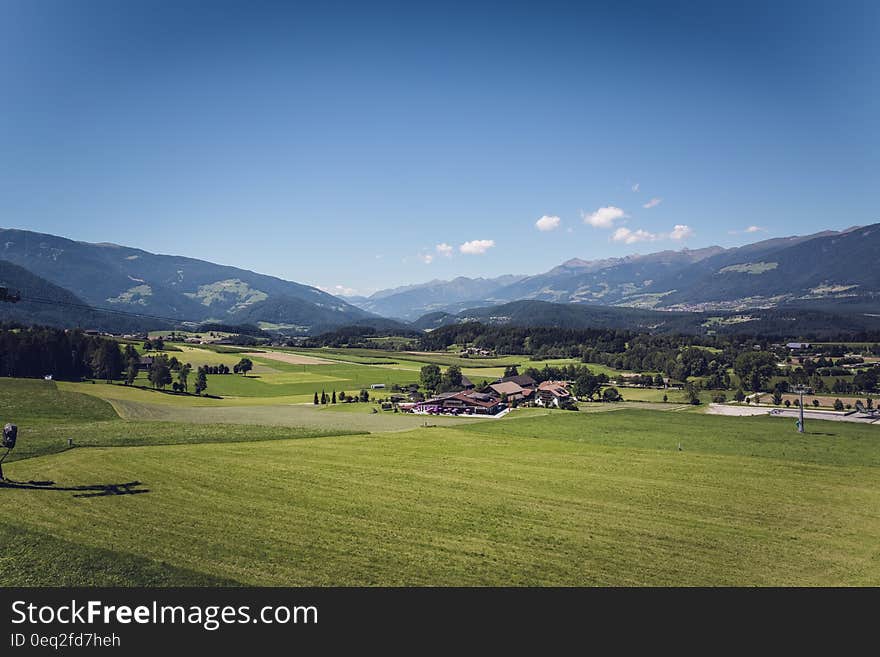 Green Grass Field Under Blue Sky