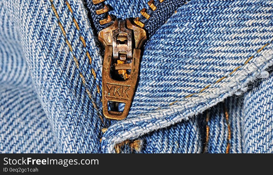 A close up of a zipper in jeans. A close up of a zipper in jeans.