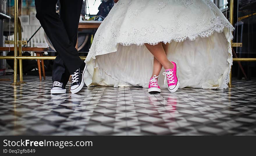 Woman Wearing Pink and White Low Top Shoes Dancing Beside Man