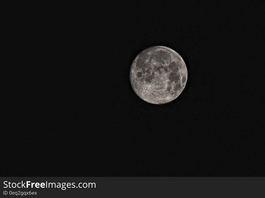 The full moon in the night sky.