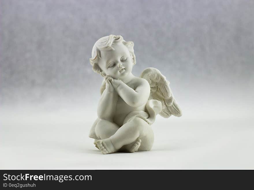 White Ceramic Figurine of Angel Illustration