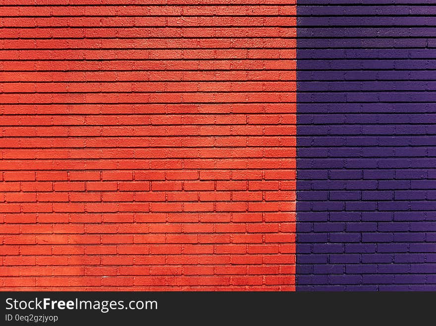 A red and dark blue brick wall. A red and dark blue brick wall.