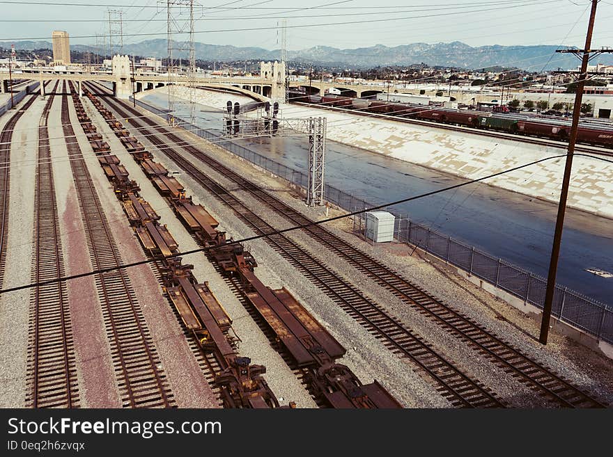 Several railway lines next to a canal. Several railway lines next to a canal.