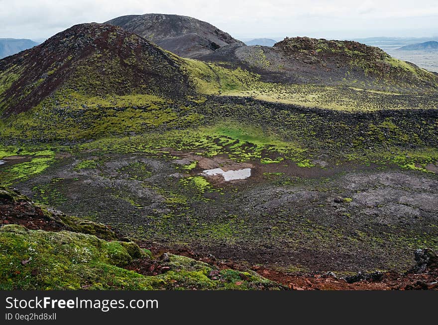 Hills and a a bog in a valley covered in moss. Hills and a a bog in a valley covered in moss.