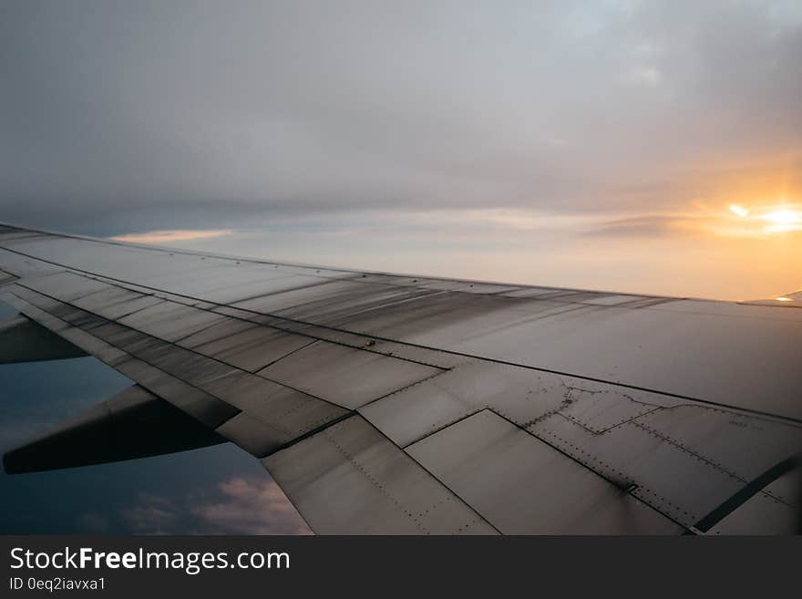 The wing of an airplane traveling through clouds. The wing of an airplane traveling through clouds.