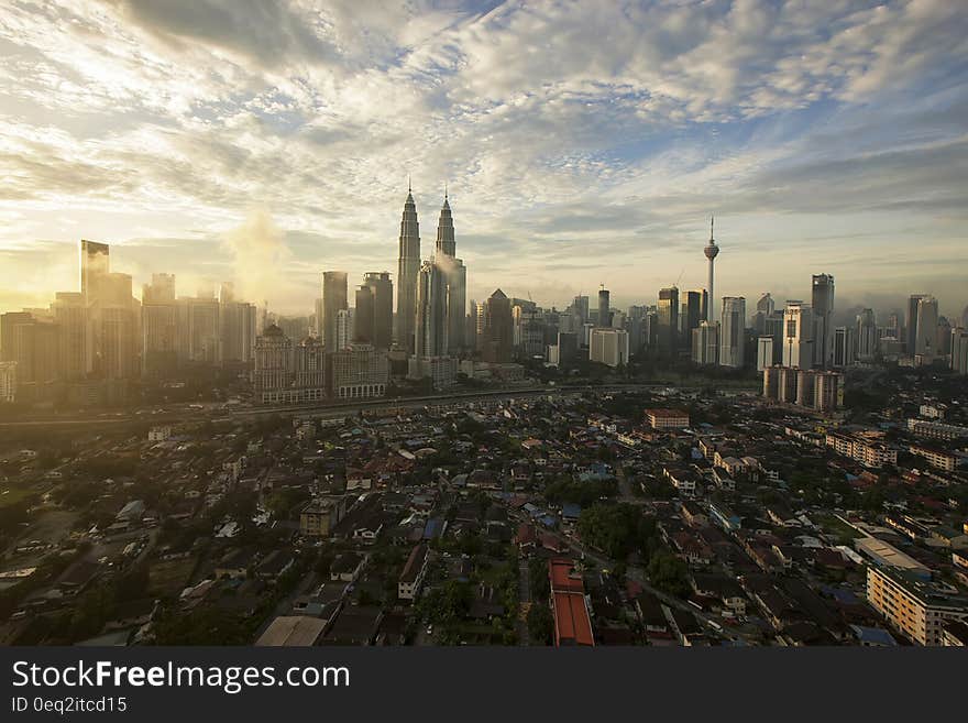 City High Under Cloudy Sky during Daytime