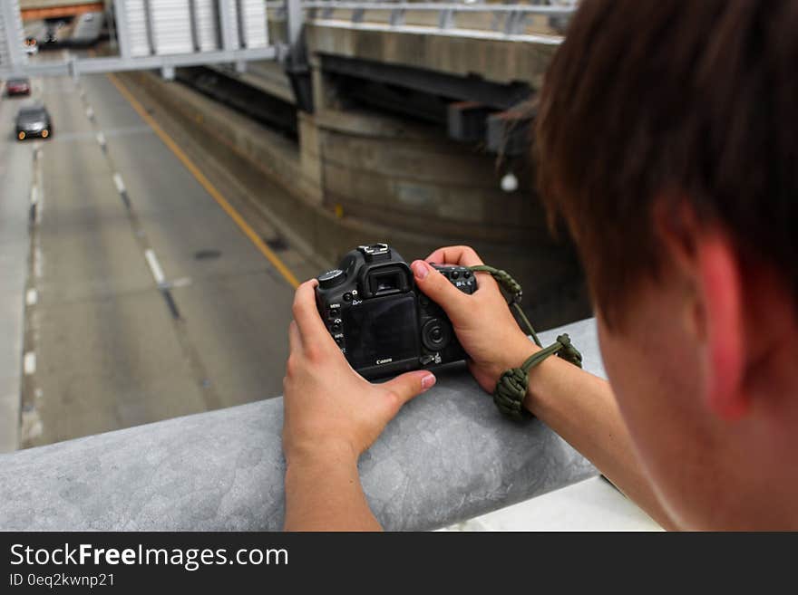 Person Holding Dslr Camera