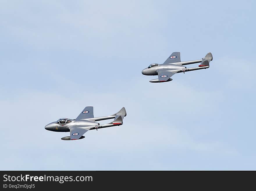 Grey Jet Plane on Air Under Blue Sky during Daytime