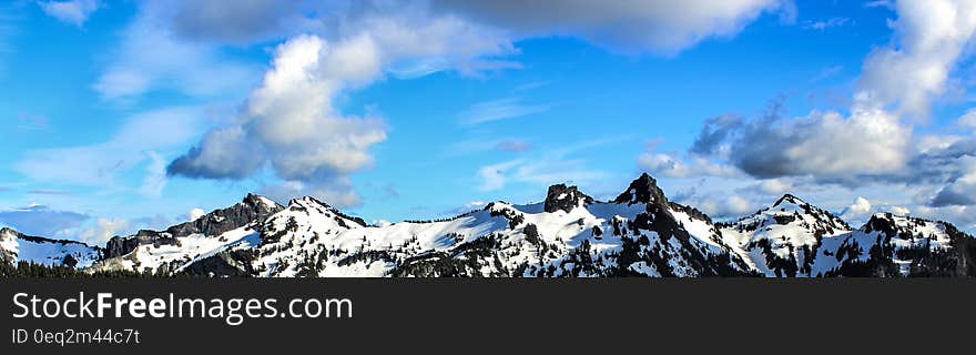 White and Black Snowy Mountain Under Blue Cloudy Sky