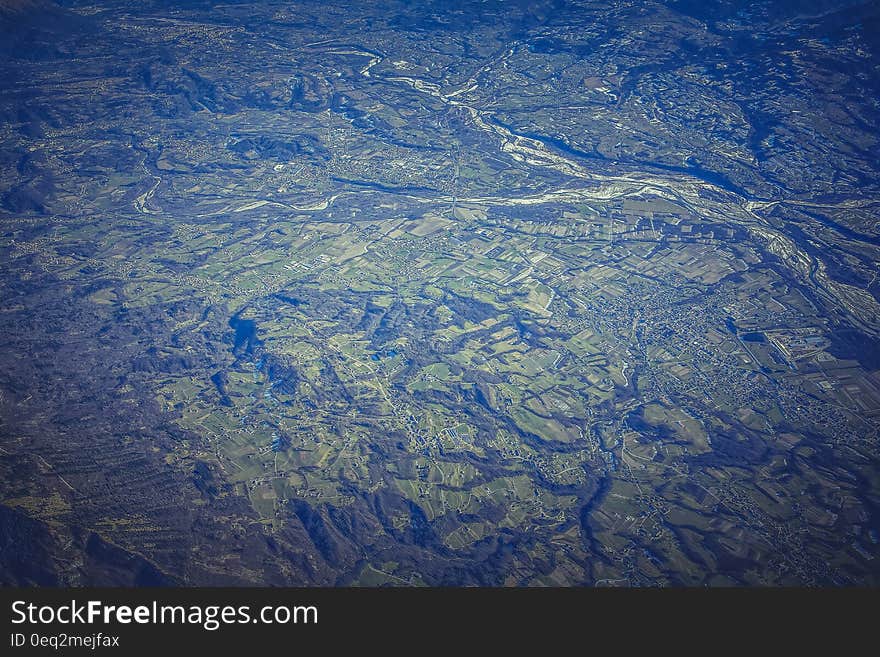 A bird's eye view over a green landscape. A bird's eye view over a green landscape.