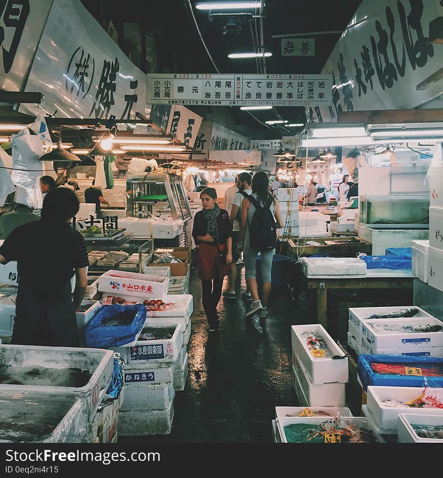 Person Waling on Market in Meat and Fish Section