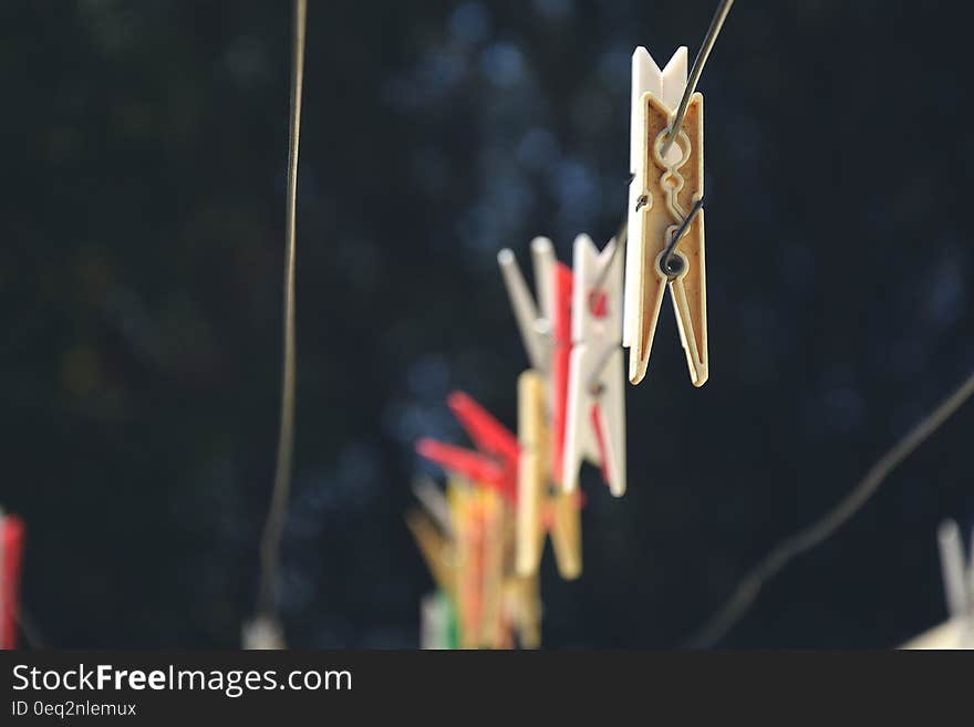 Clothes lines with clothes pins hanging from a line. Clothes lines with clothes pins hanging from a line.