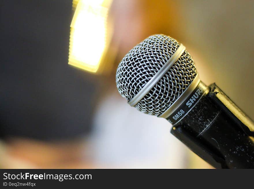 A close up of a microphone on stage. A close up of a microphone on stage.