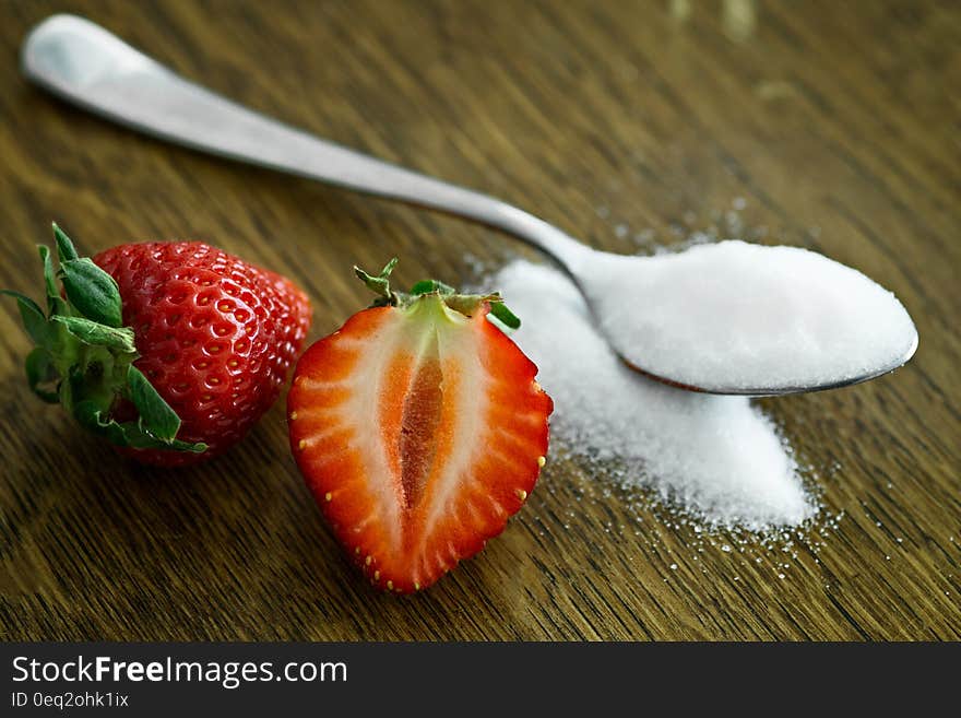 Strawberry Beside Spoon of Sugar