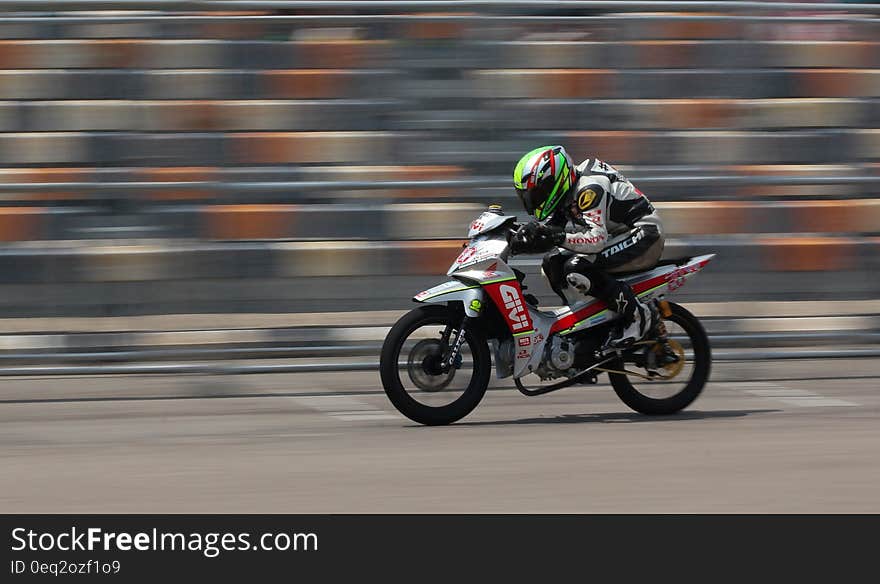 Motorcycle Racer on Silver Motorcycle