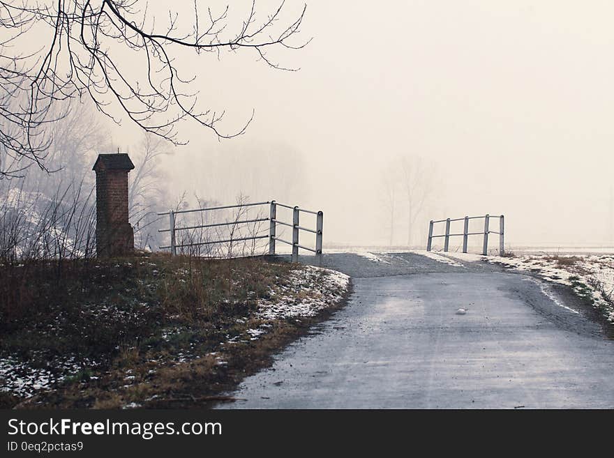 Scenic view of bridge and road in snowy countryside landscape, winter scene. Scenic view of bridge and road in snowy countryside landscape, winter scene.