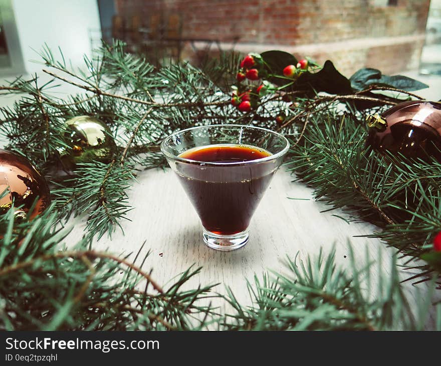 Green Pine Tree Leaves Wreathe With Teacup in the Middle