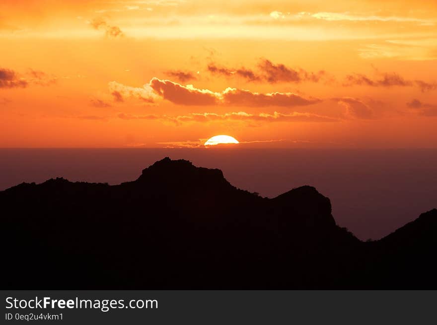 Silhouette of Mountain Under Sunset