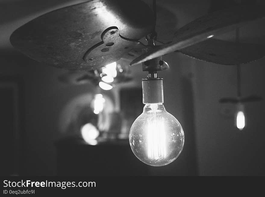 Light bulb illuminates dark room - idea concept