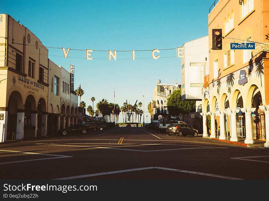 Venice city street scene with name of city on banner across road, Italy.