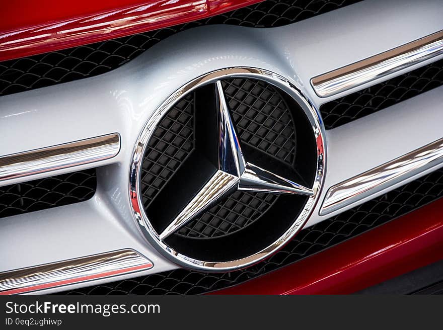 A closeup of the Mercedes logo. A closeup of the Mercedes logo.