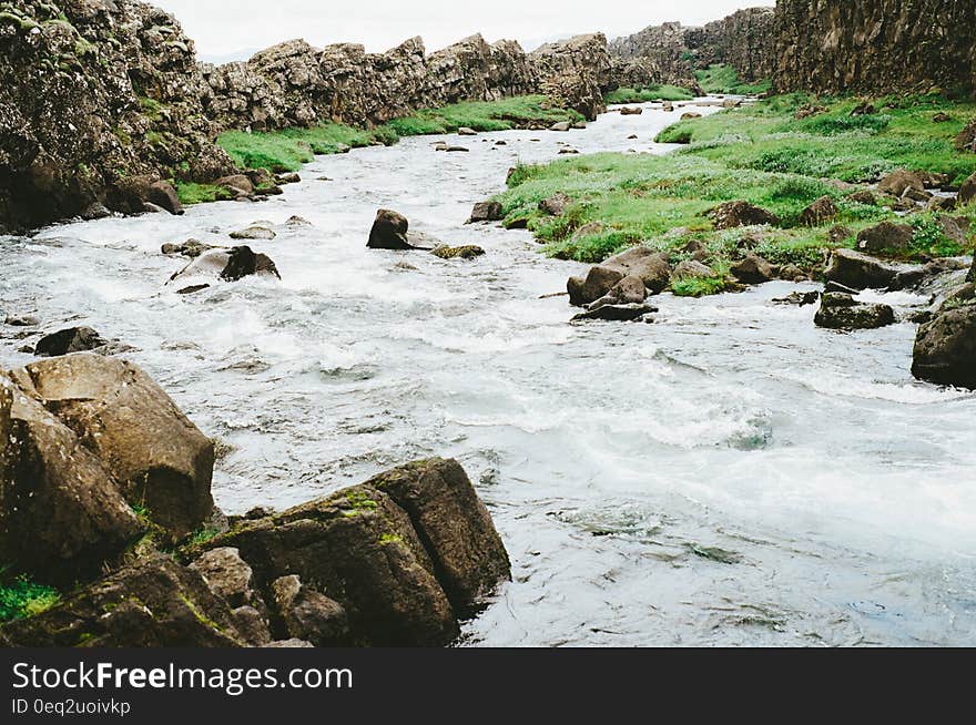 A stream surrounded by stones. A stream surrounded by stones.