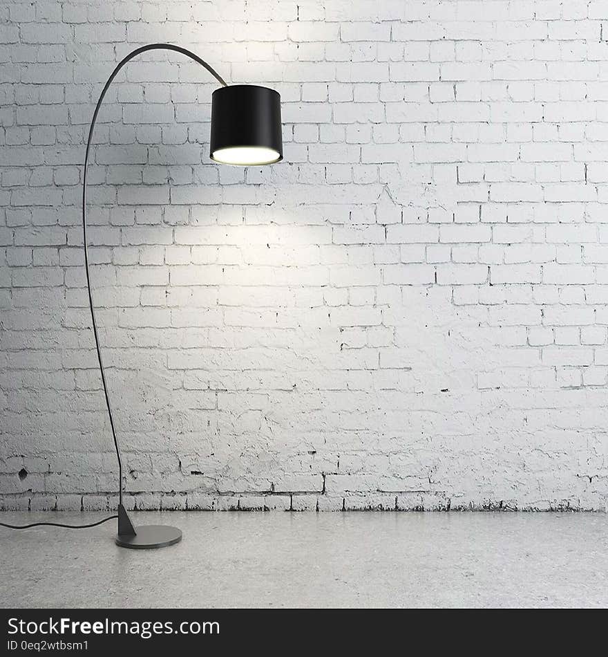 Turned on Black Torchiere Lamp