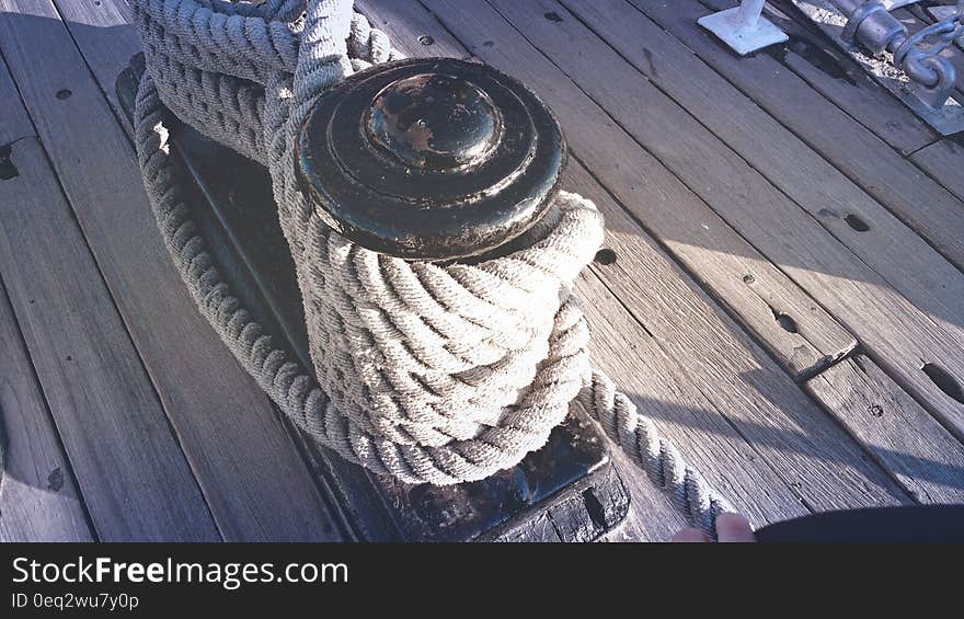 White Rope Tied on Black Steel Bar