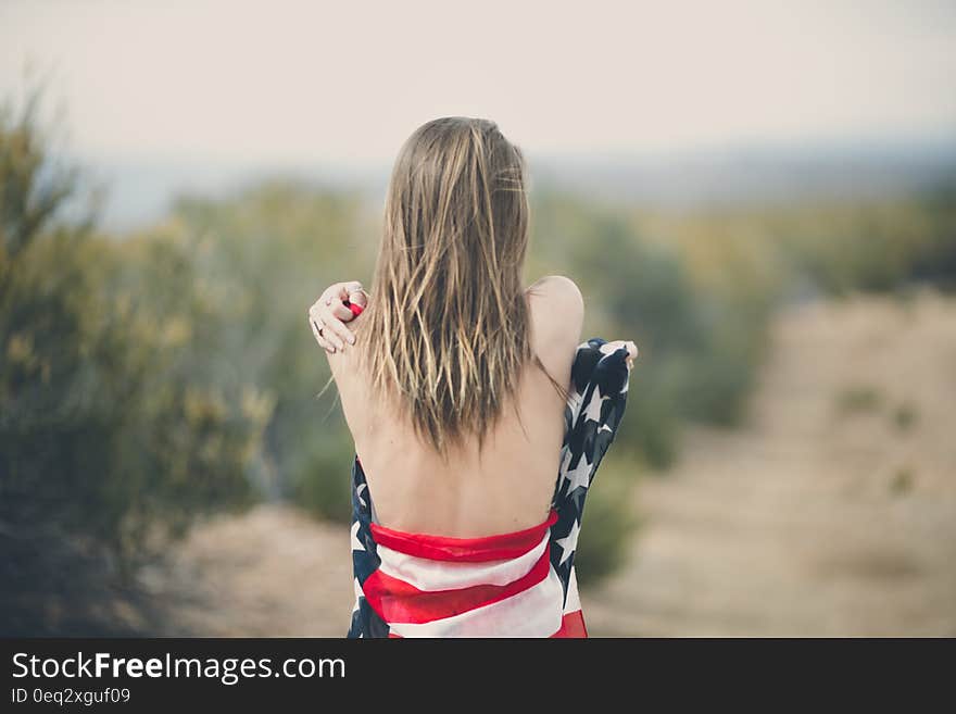 Woman Strapping Her Body of American Flag