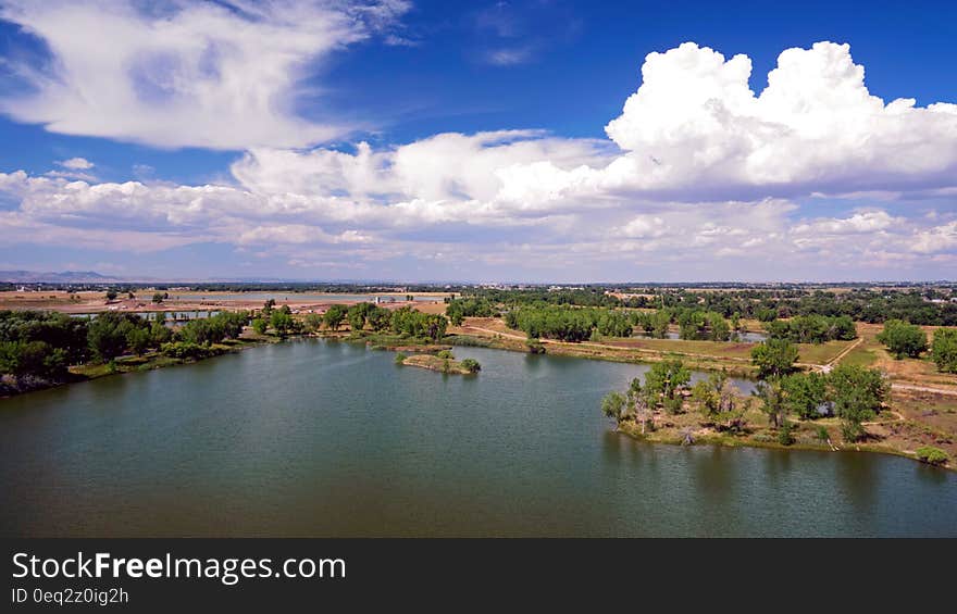 A panoramic view of a lake in the countryside. A panoramic view of a lake in the countryside.