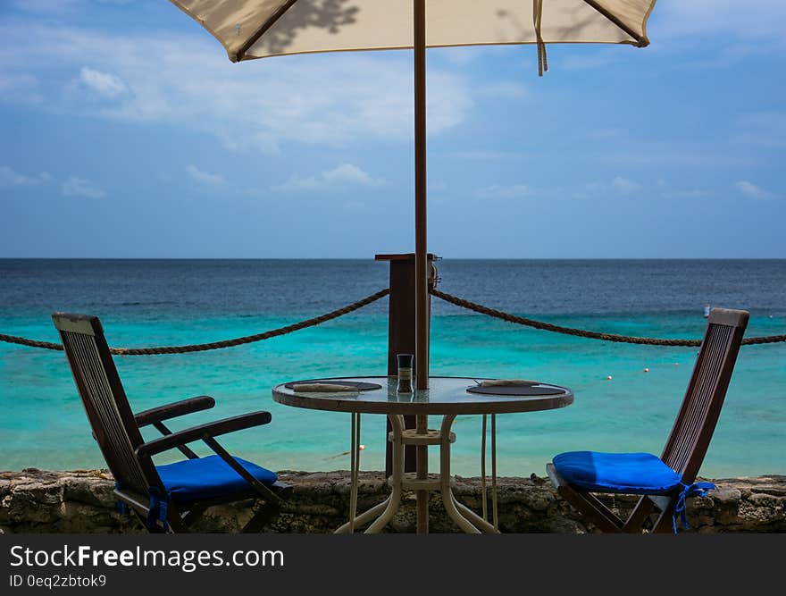 Restaurant table with two seats on the beach at the seaside. Restaurant table with two seats on the beach at the seaside