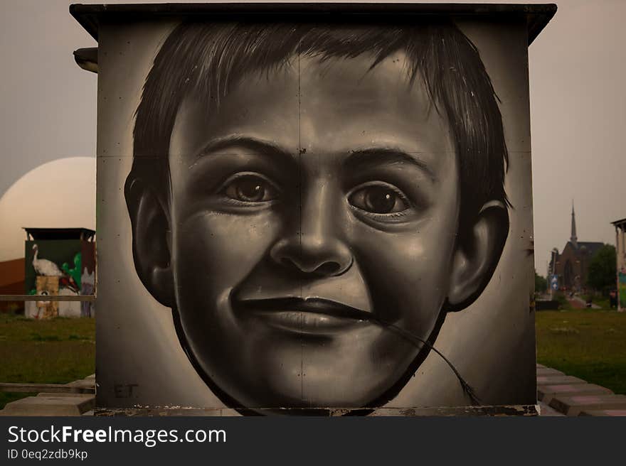 A grafitti depicting the face of a small boy. A grafitti depicting the face of a small boy