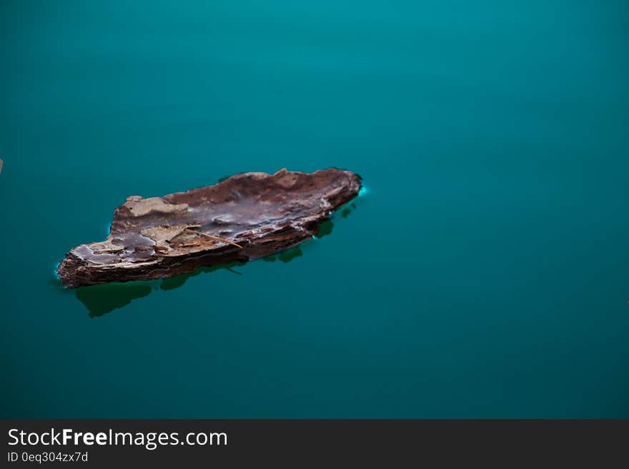 An isolated boat in the middle of the water. An isolated boat in the middle of the water