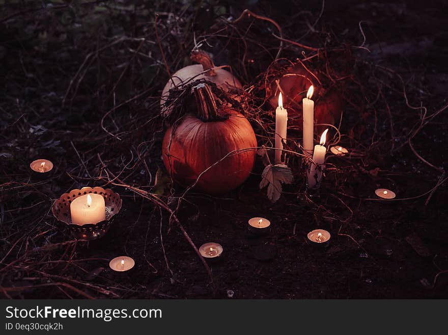 Jack O Lantern Beside Candles Halloween Decor