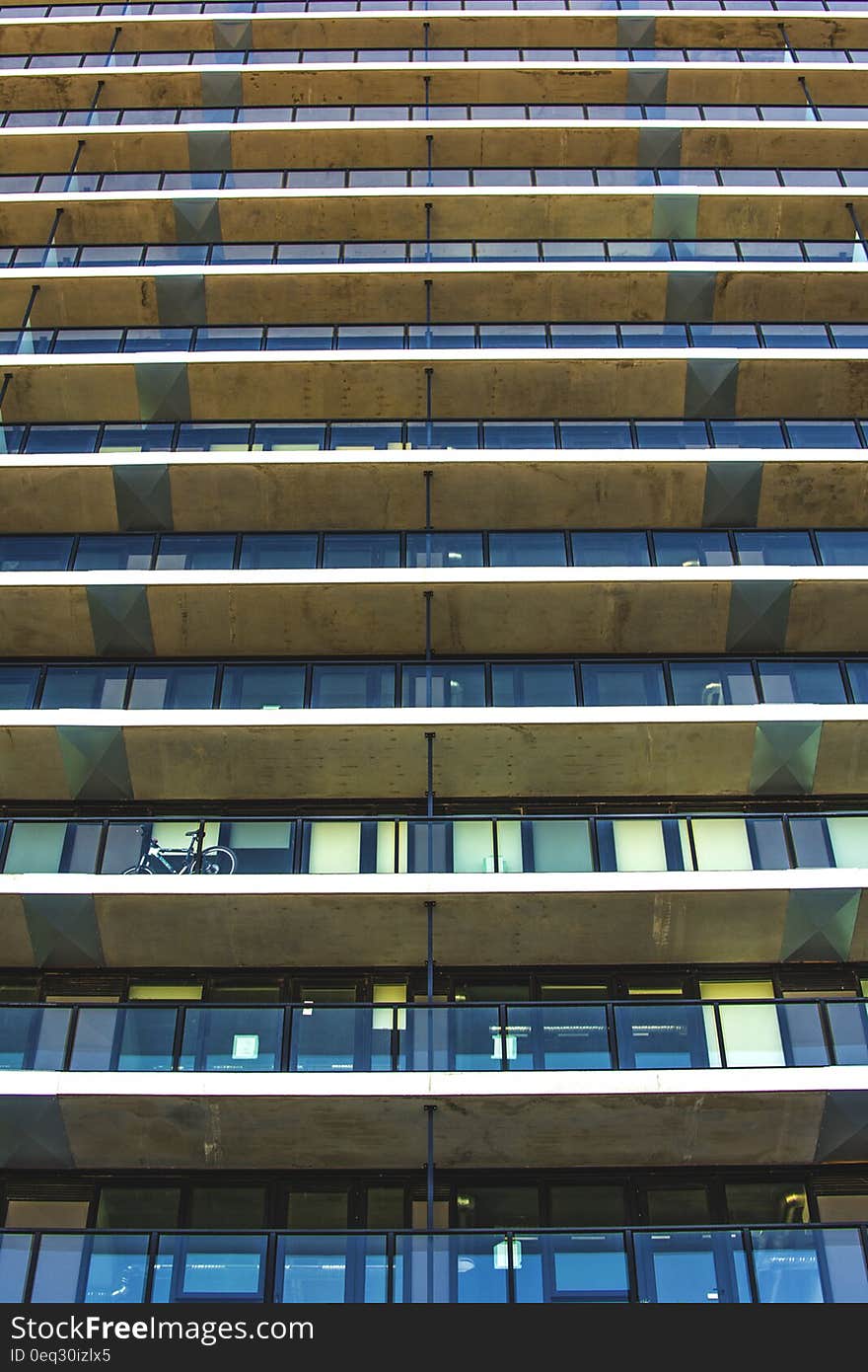 Facade view of an apartment building with balconies.