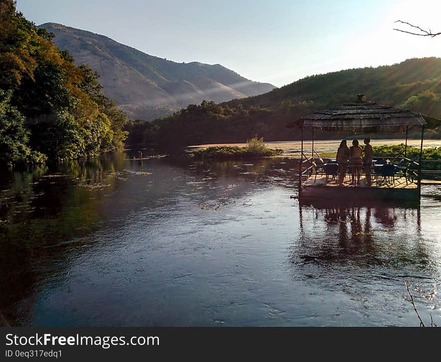 A terrace in the middle of the lake having people admiring the landscape. A terrace in the middle of the lake having people admiring the landscape