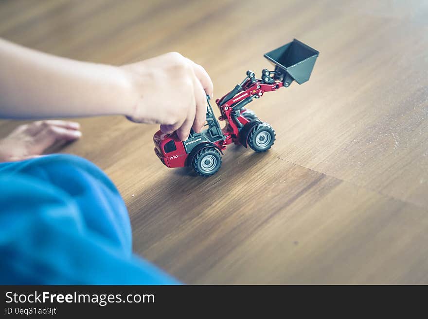 Child Playing Front Loader Toy