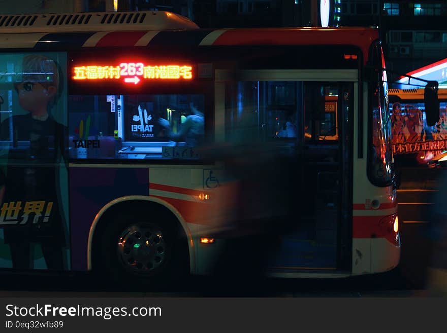 Silver City Bus on a City Street at Night